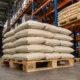Loaded EPAL pallet with stacked cargo on warehouse floor showing certified timber deck and racking bay in background