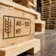 IPPC compliance stamp on a wooden export pallet at an Australian shipping dock