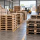 Wooden pallets at different stages of their lifecycle, from new to repaired