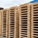 Stacked softwood pallets ready for export at a dispatch yard