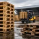 why hardwood pallets last longer in harsh environments shown with durable pallets in wet warehouse and forklift handling